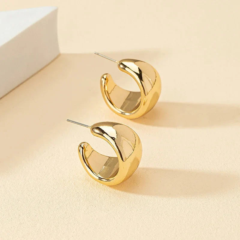 Runde, klobige Ohrringe aus Gold für Damen