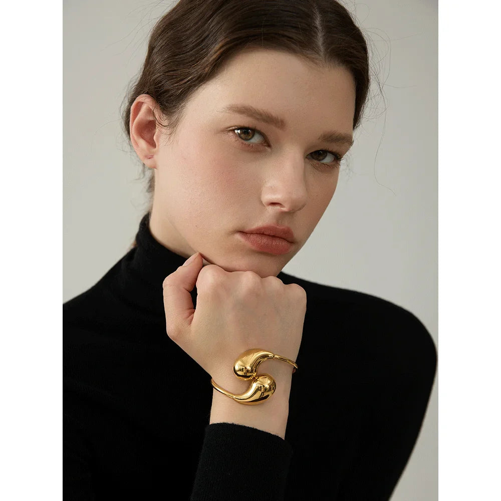 Bracciale rigido regolabile in acciaio inossidabile placcato oro 18 carati a forma di goccia d'acqua per donna