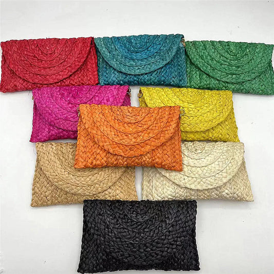 Pochette in paglia con interno in tessuto