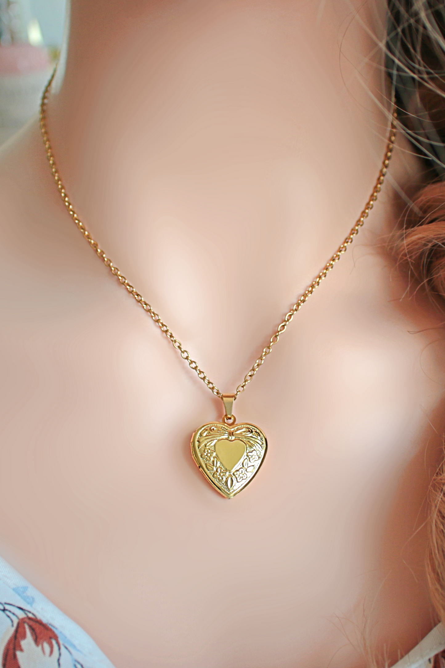 Collana con medaglione a cuore da 18 carati