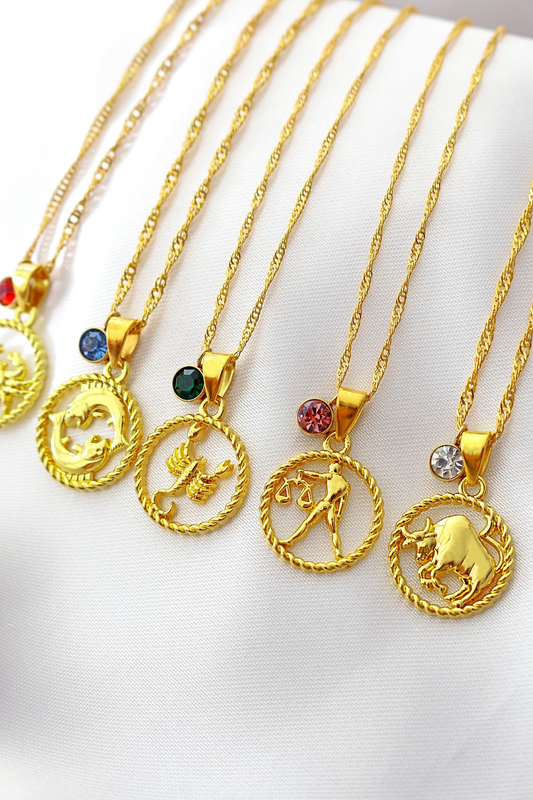 Collana con segno zodiacale e pietra portafortuna in oro 18 carati
