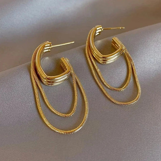 Orecchini geometrici con nappe in metallo